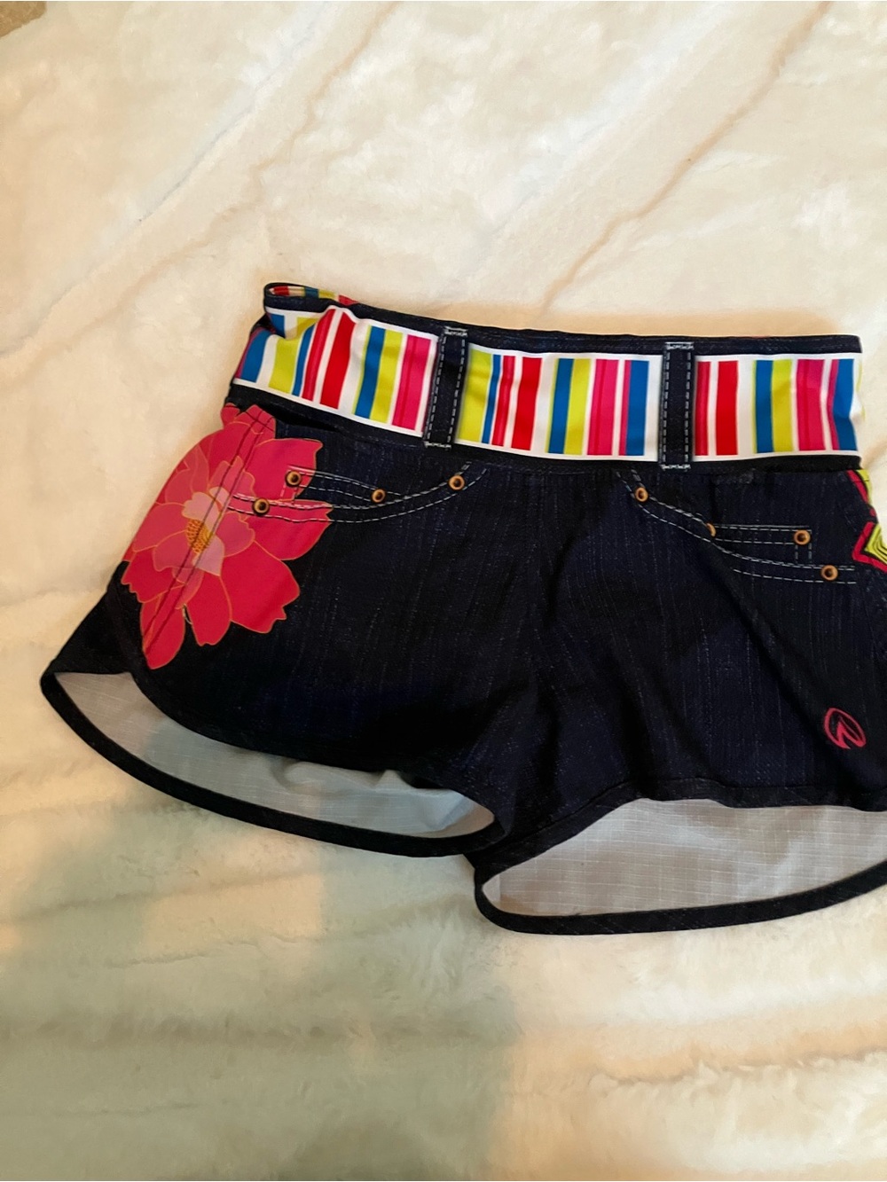 Inknburn  Denim Shorts with Multicolor Striped Belt and Pink Floral Accent